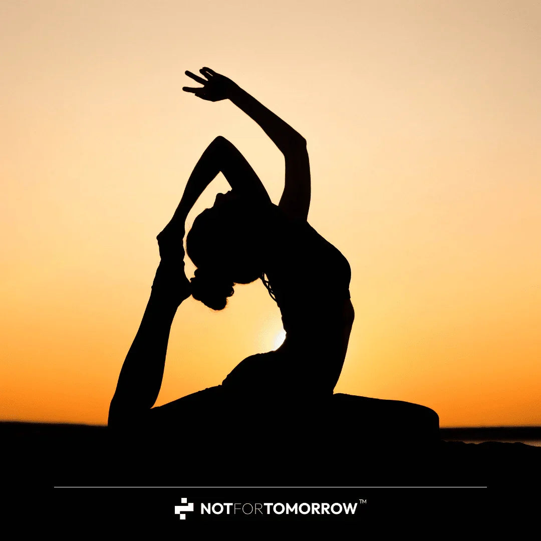 Silhouette of woman doing yoga pose at sunset, promoting health, wellness, flexibility