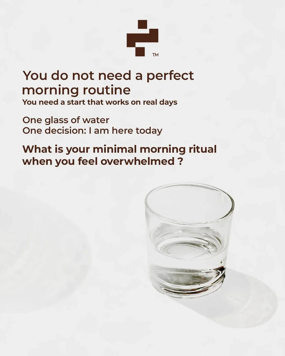 Minimal morning routine quote with a glass of water on white background, healthy habits inspiration