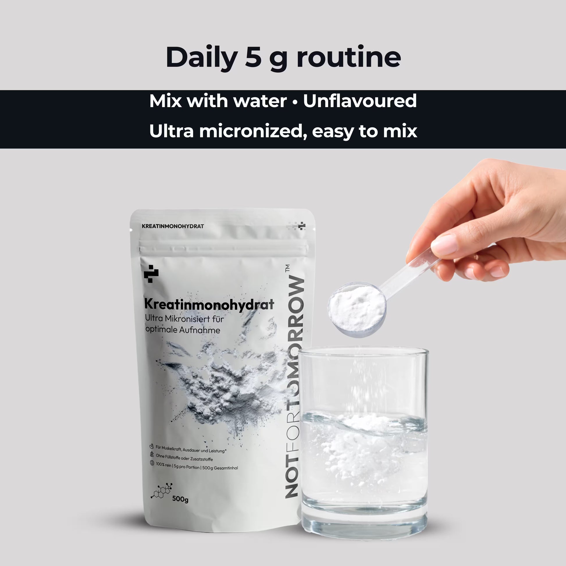 Hand adding creatine monohydrate powder to water, supplement bag and glass on light background