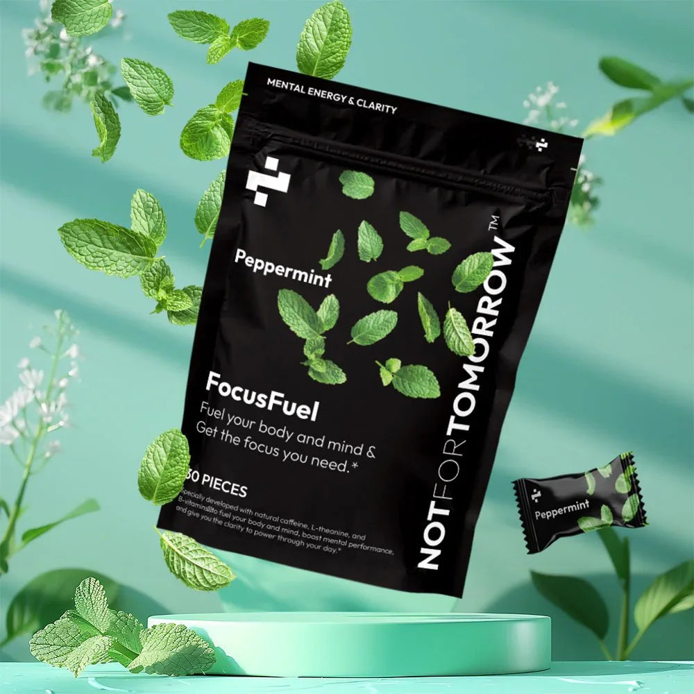 Peppermint FocusFuel supplement bag with mint leaves, clean green background.