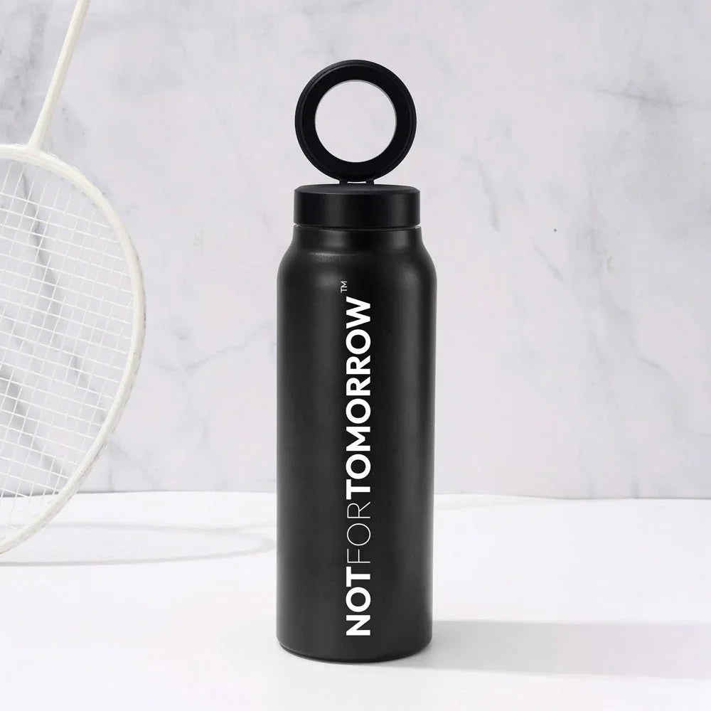 Black double-walled insulated water bottle 950ml with ring lid on marble background